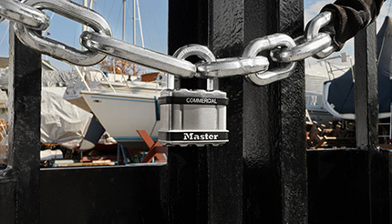 A lock on a chain at a marina